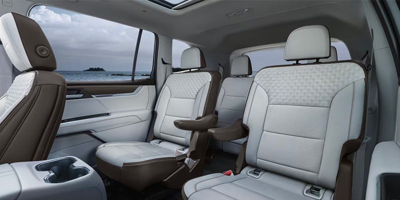 White leather seats in a GMC Acadia.