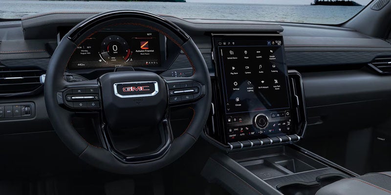 Cockpit and portrait screen of a 2026 GMC Acadia.